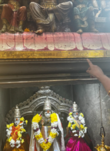 Signs written in both Tamil and English in the shrines of the temple