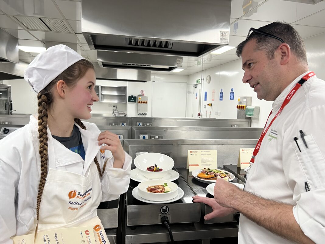 Winner Pippa Cooper with one of the professional chef judges Richard Nicholson
