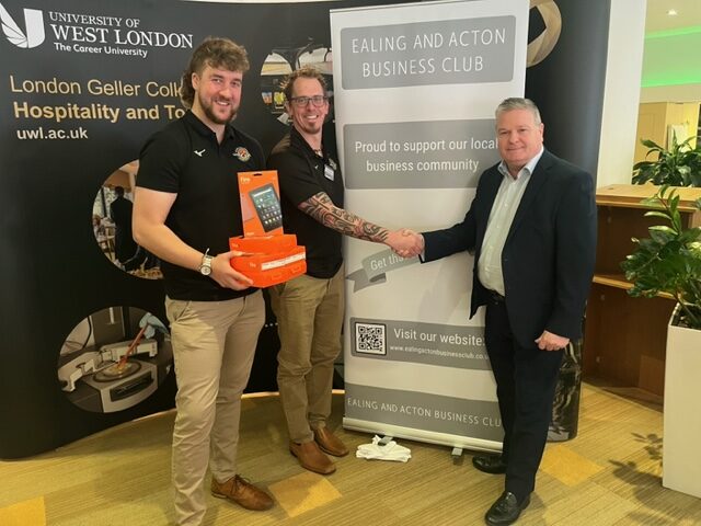 Paul Harty of Goview London estate agents donating 7 Amazon Fire tablets to Trailfinders Foundation to give to Featherstone school in Southall