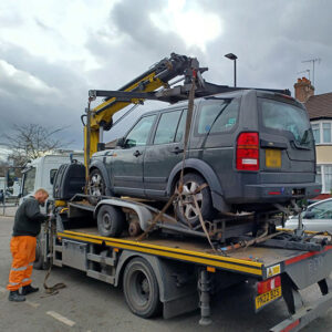 Car being towed away from Hanger Hill