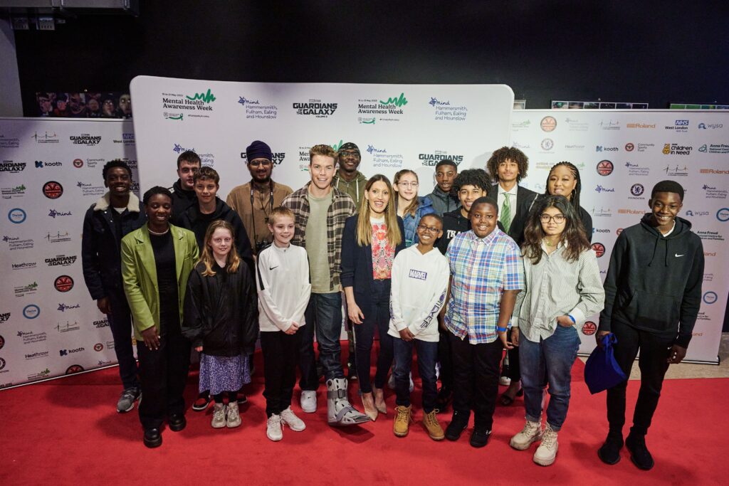 Will Poulter with young people