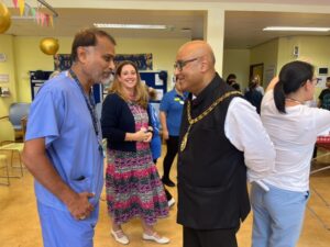 Mayor of Ealing, Councillor Hitesh Tailor talks to staff at Clayponds