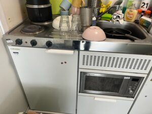 The kitchen at Marston Court with only one working hob and microwave not working along with no hot water