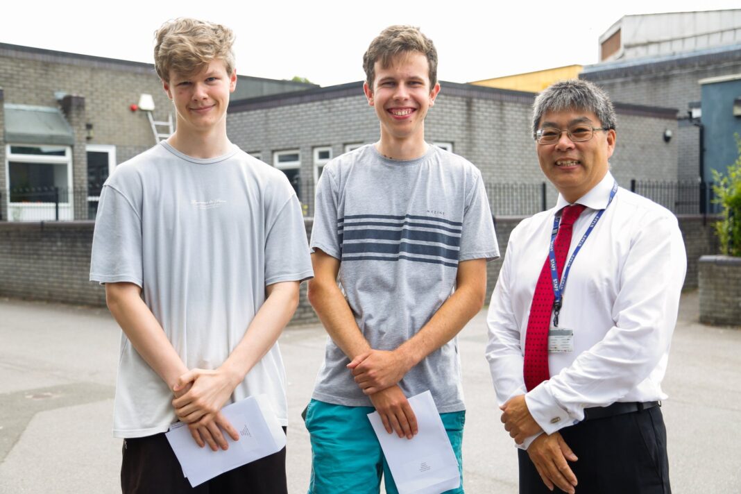 Owen Parfitt-ford and Robin Alsop (left to right), who both scored 4A* grades with Elthorne Park High School headteacher Eliot Wong