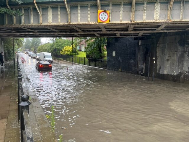 Car trapped on flooded Victoria Road