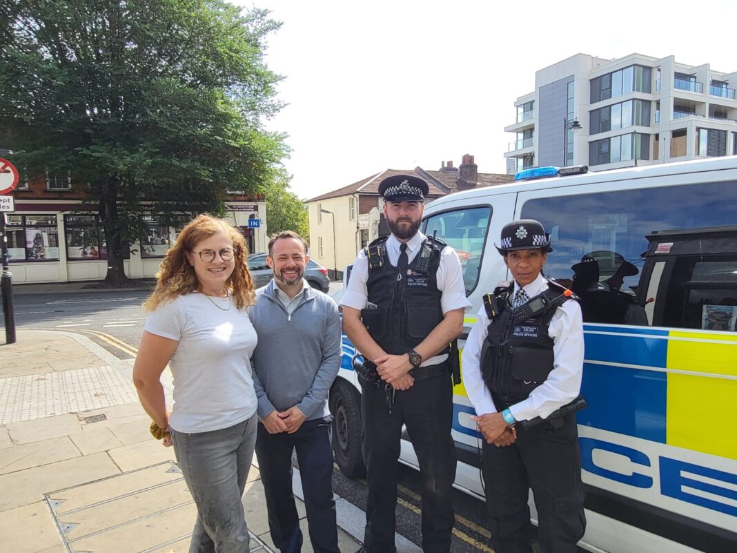 Councillor Connie Hersch, Liberal Democrat Opposition Spokesperson for Policing and Councillor Gary Malcolm, Leader of the Opposition with police in Hanwell