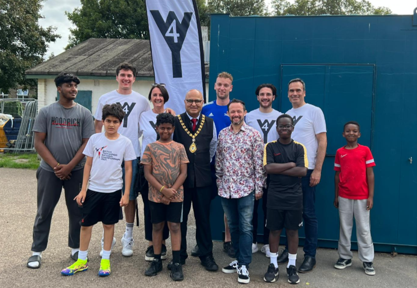 Group of local children attending the event, coaches, Sally Chacatté, founder of W4 Youth; Mayor of Ealing, Hitesh Tailor; Gary Malcolm, Councillor and W4 Youth Trustee; and Marcell Chacatté, W4 Youth Trustee. Photo: W4 Youth