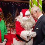 King Charles III visits Ealing Broadway and meets Santa Claus. Photo: SWNS / British Land.