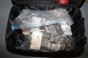 Money in suitcase storage unit. Photo: National Crime Agency