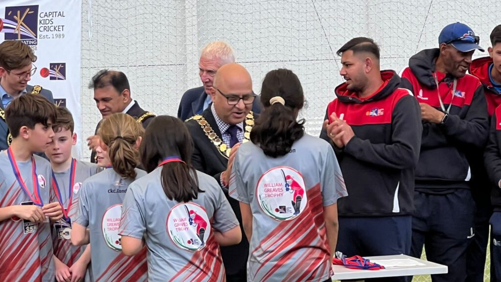 Mayor of Ealing, Councillor Hitesh Tailor presents winning medals to Little Ealing Primary School cricket players.