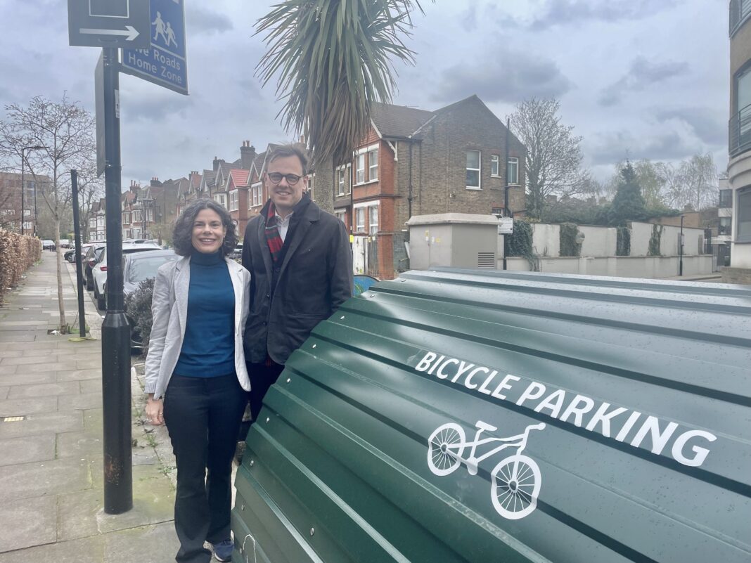 Councillor Deirdre Costigan and Councillor Peter Mason by bike hangar. Photo: Ealing Council